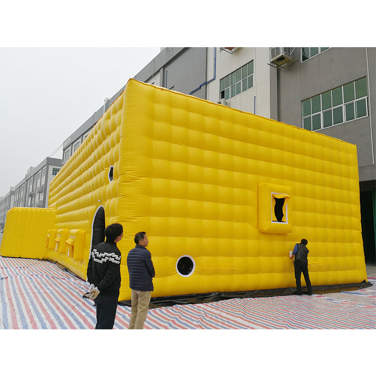 Large yellow inflatable tent, outdoor temporary event venue, disaster relief medical emergency inflatable building