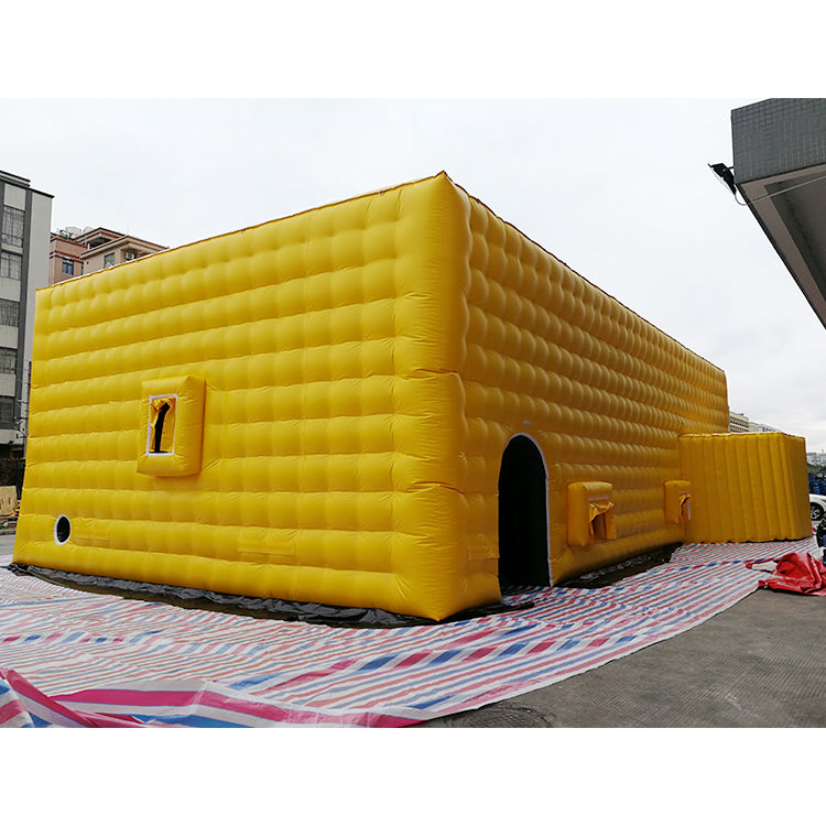 Large yellow inflatable tent, outdoor temporary event venue, disaster relief medical emergency inflatable building